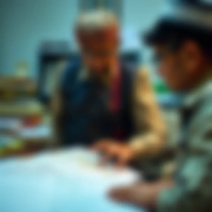 Administrative officer examining land records and maps for regional governance